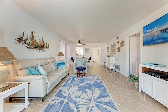 living room with light tile patterned floors and ceiling fan