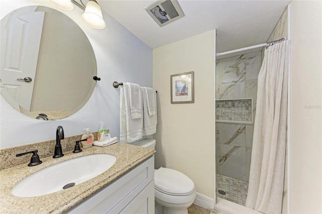 bathroom featuring vanity, toilet, and a shower with shower curtain