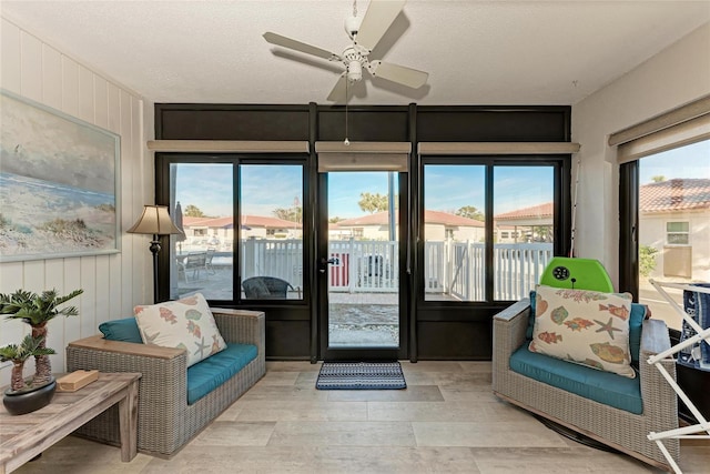 sunroom / solarium with ceiling fan