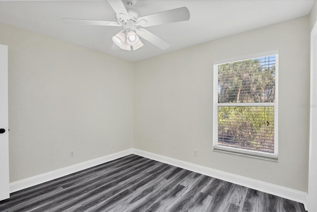 empty room featuring dark hardwood / wood-style floors and ceiling fan