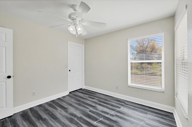 unfurnished room featuring dark hardwood / wood-style floors and ceiling fan