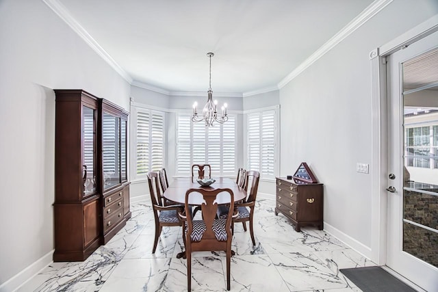 dining room featuring crown molding, a wealth of natural light, and a notable chandelier