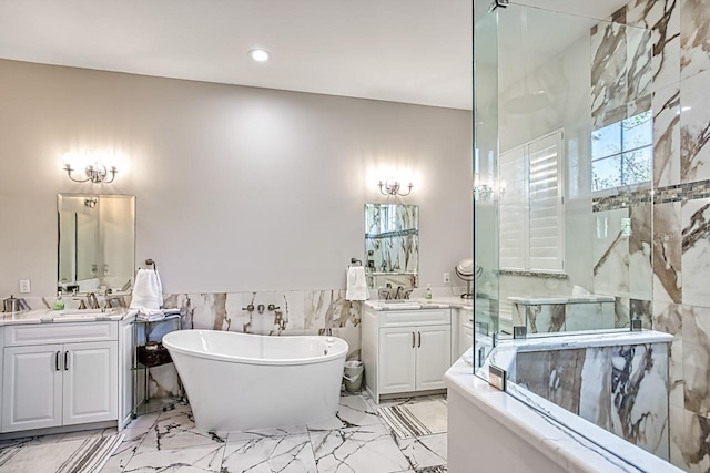 bathroom featuring vanity, tile walls, and a bathing tub