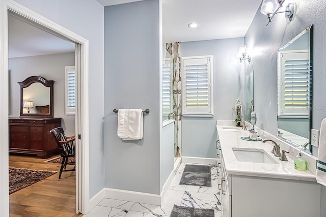 bathroom with vanity and an enclosed shower