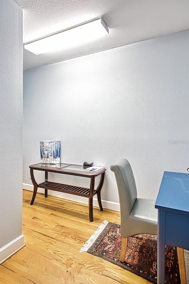 office area with wood-type flooring