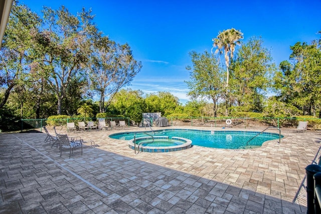 view of pool featuring a patio area and a community hot tub