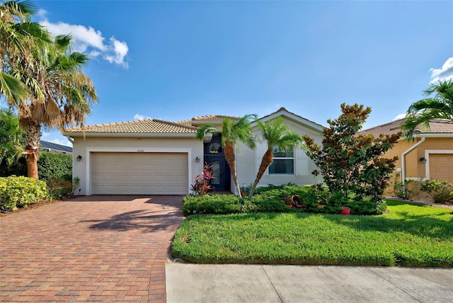 view of front of home featuring a garage and a front yard