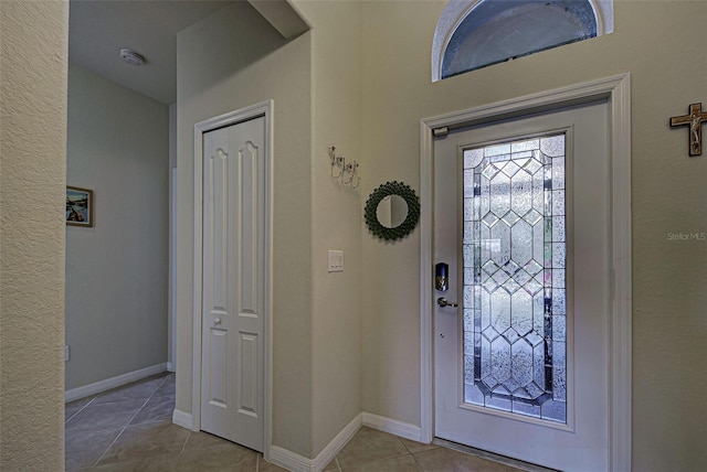 entryway with light tile patterned floors