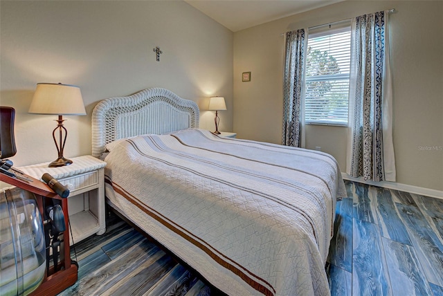 bedroom featuring dark hardwood / wood-style flooring