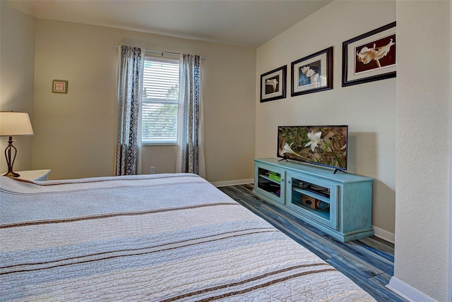 bedroom featuring dark hardwood / wood-style floors