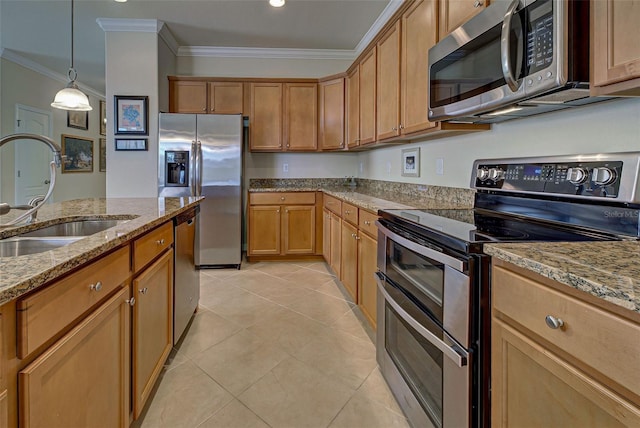 kitchen with sink, crown molding, appliances with stainless steel finishes, light stone countertops, and decorative light fixtures