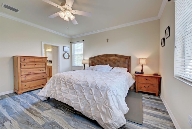 bedroom featuring hardwood / wood-style flooring, ceiling fan, ornamental molding, and connected bathroom