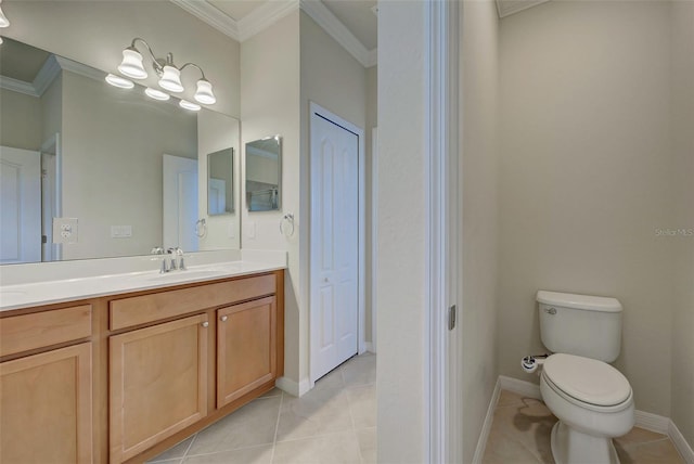 bathroom featuring tile patterned flooring, vanity, ornamental molding, and toilet