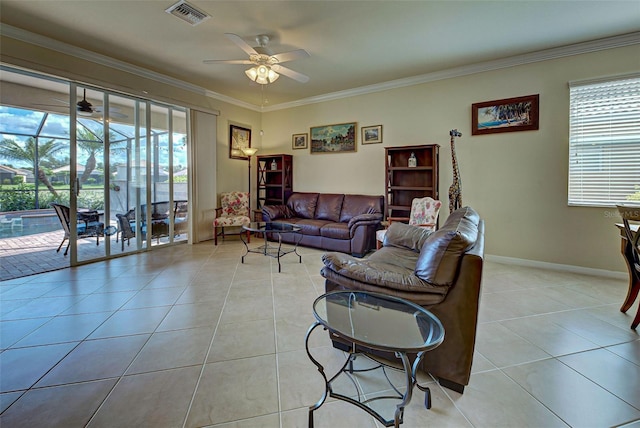 living room featuring light tile patterned floors, ornamental molding, and a healthy amount of sunlight