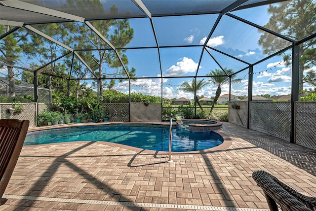 view of swimming pool with a patio, glass enclosure, and an in ground hot tub