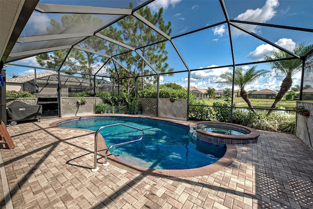 view of swimming pool featuring an in ground hot tub, glass enclosure, and a patio