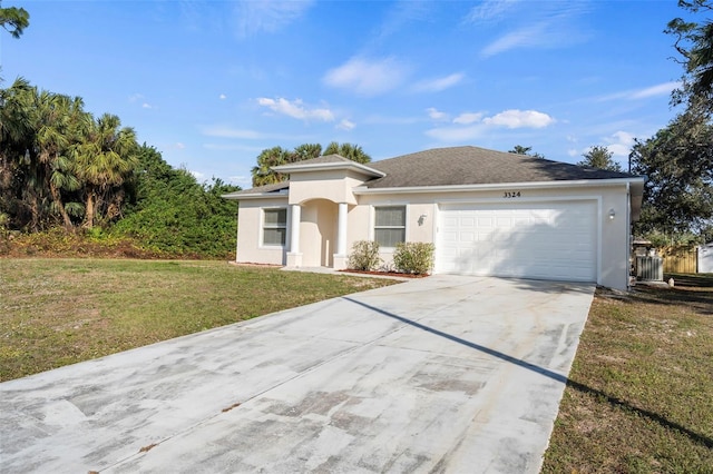 view of front facade with a garage and a front lawn