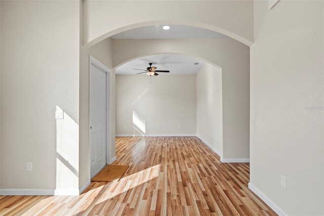 unfurnished living room with light hardwood / wood-style floors and ceiling fan