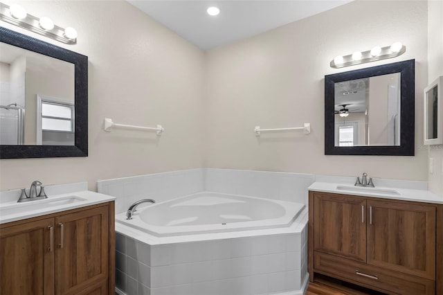 bathroom featuring vanity and plus walk in shower