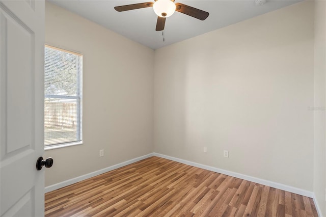 spare room with ceiling fan and light hardwood / wood-style flooring