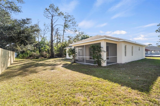 view of yard featuring a sunroom