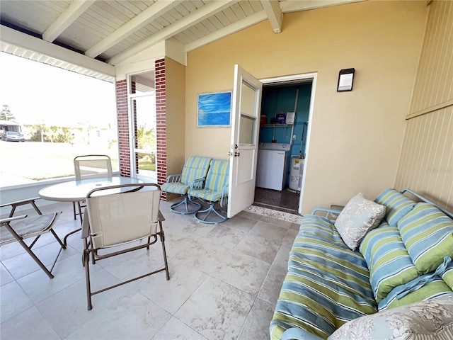 view of patio / terrace with outdoor dining space and washer / dryer