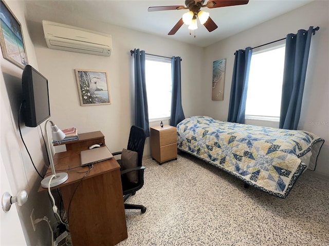 bedroom featuring ceiling fan, multiple windows, and a wall mounted AC