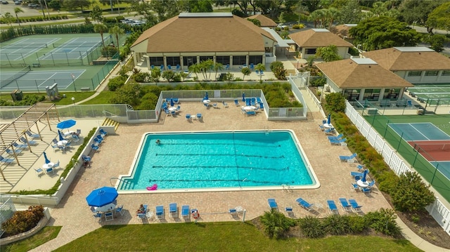 view of pool featuring fence and a patio