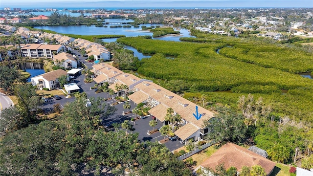 birds eye view of property with a water view and a residential view