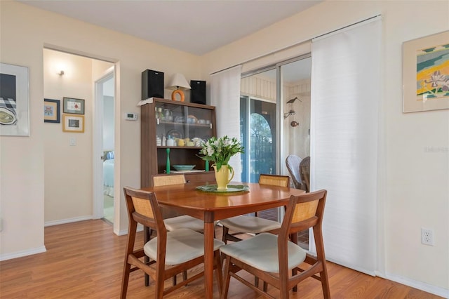 dining area with light wood-type flooring