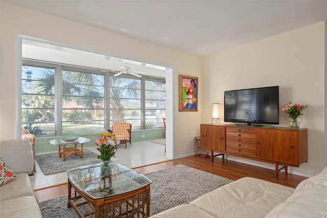 living room with hardwood / wood-style flooring and ceiling fan