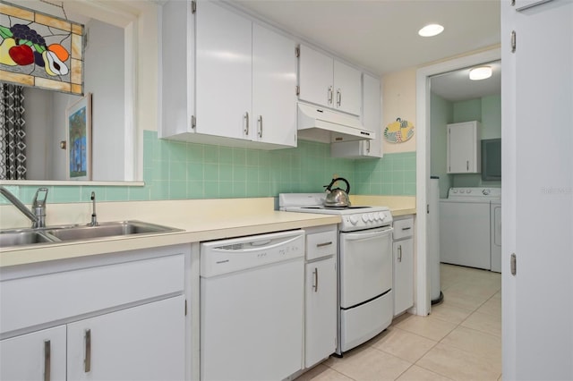 kitchen featuring light tile patterned flooring, sink, backsplash, white cabinets, and white appliances