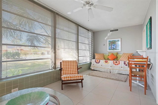 sunroom with plenty of natural light and ceiling fan