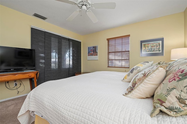 bedroom with ceiling fan and carpet flooring