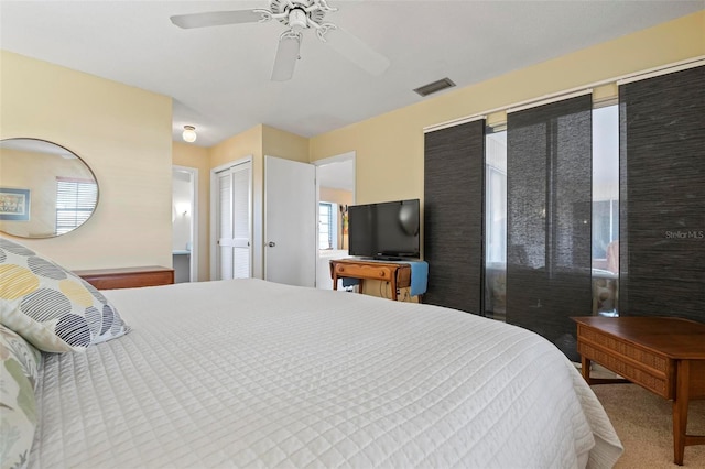 bedroom with ceiling fan and carpet