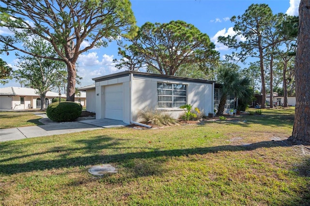 exterior space featuring a yard and a garage