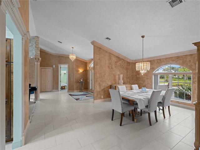 dining area featuring crown molding, visible vents, and a notable chandelier