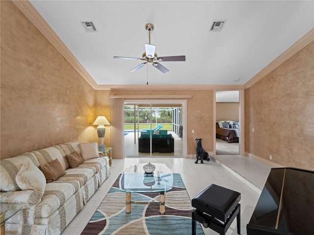 living area featuring visible vents, a ceiling fan, and ornamental molding