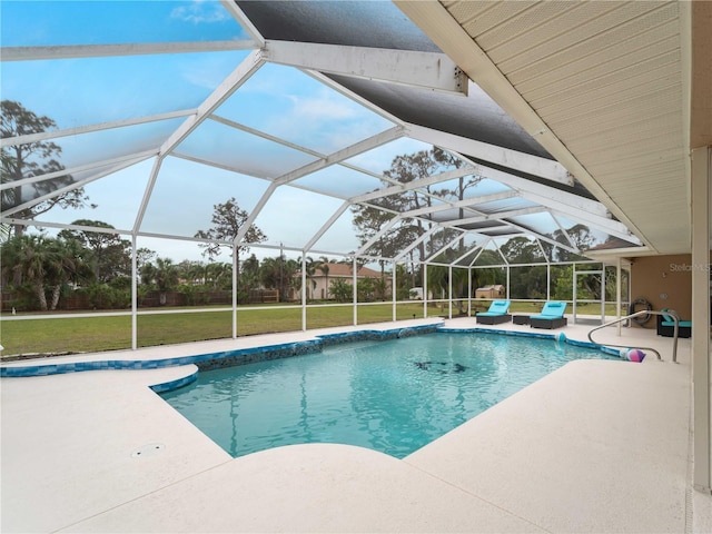 pool with glass enclosure, a patio area, and a lawn