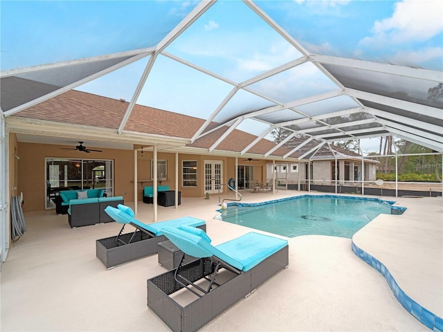 pool featuring a ceiling fan, glass enclosure, an outdoor hangout area, french doors, and a patio area