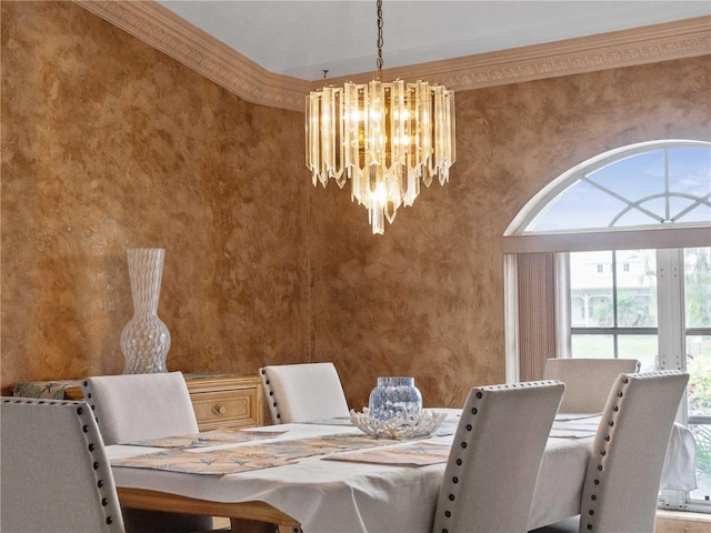 unfurnished dining area featuring a chandelier, ornamental molding, and wallpapered walls