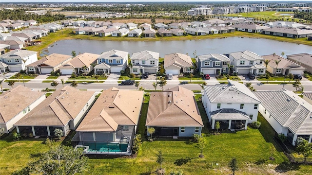 birds eye view of property with a water view