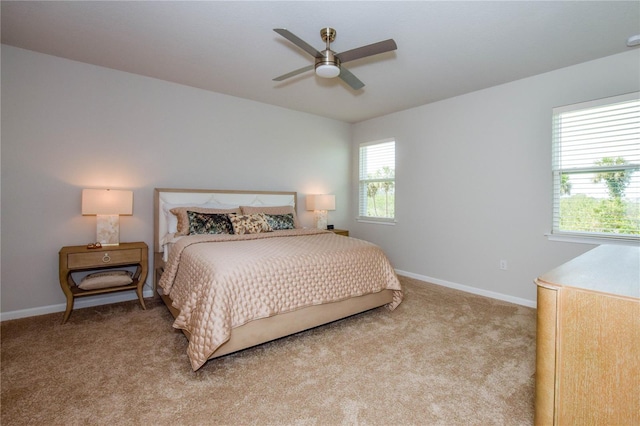 bedroom with light colored carpet and ceiling fan