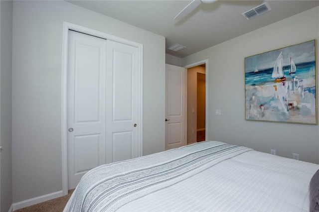 bedroom featuring a closet, ceiling fan, and carpet