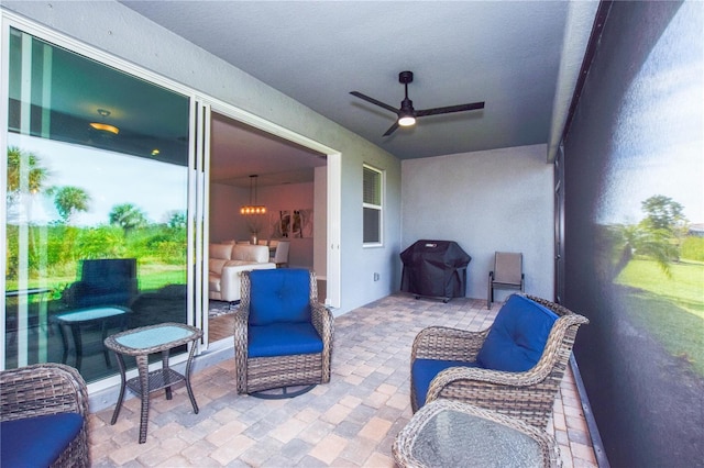 view of patio with ceiling fan and grilling area