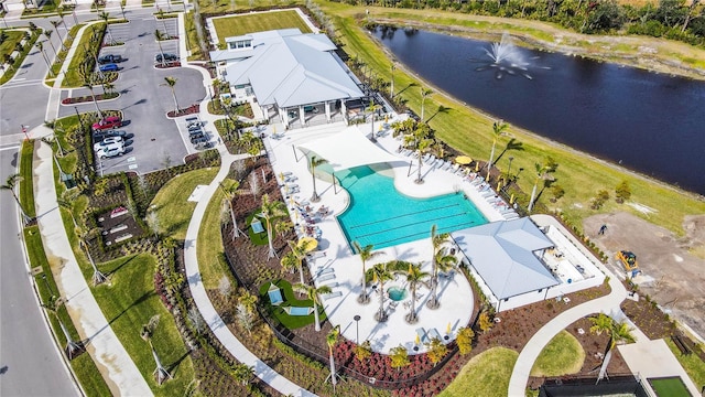 birds eye view of property with a water view