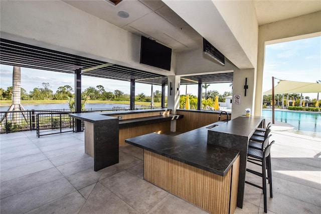 view of patio / terrace featuring a wet bar