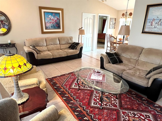 living area featuring lofted ceiling, a notable chandelier, and tile patterned floors