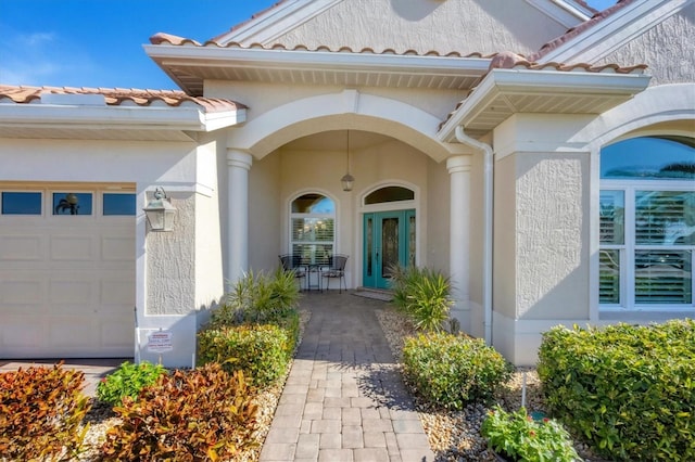 doorway to property featuring a garage