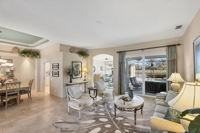 living room featuring a chandelier and light hardwood / wood-style flooring